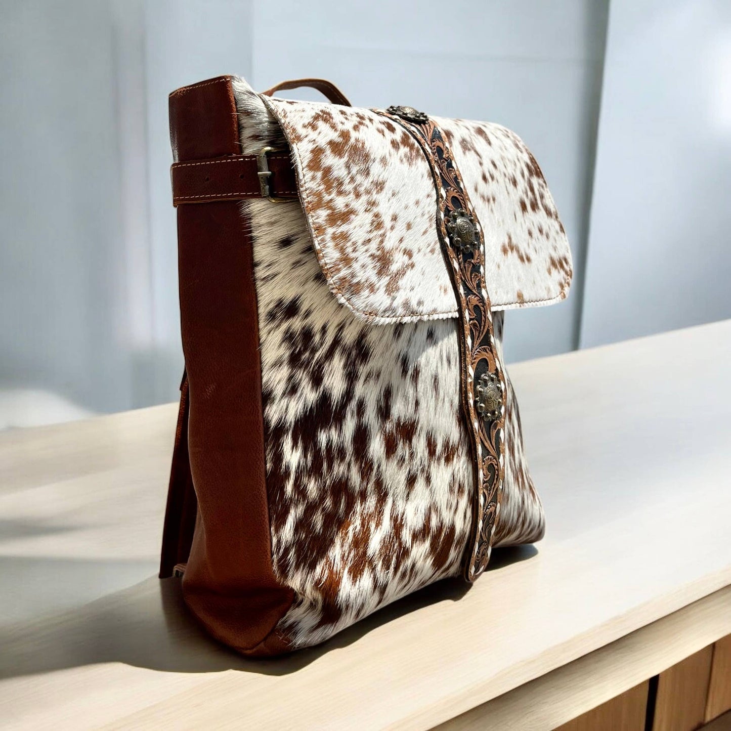 Cowhide & tooled leather backpack 